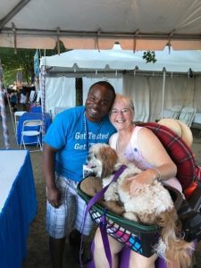 Volunteers Betty and her dog at Waterfront Blues Festival